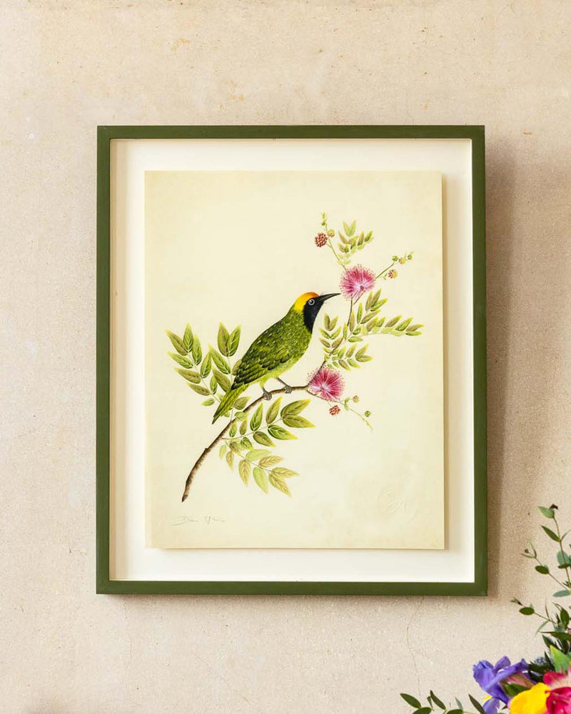 framed botanical wall art print featuring gold sparkle embellished exotic bird on tree branches with flowers hung on wall