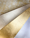 metallic painting papers for artists in mottled gold and silver, champagne, gold, and silver leaf.