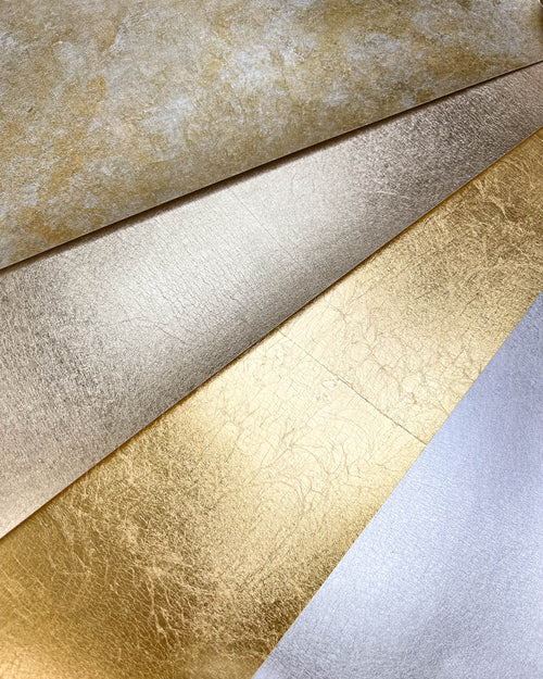 metallic papers for artists in mottled gold and silver, champagne, gold, and silver leaf.