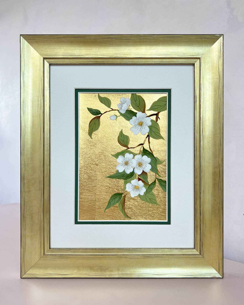 framed botanical chinoiserie painting on gold leaf paper featuring white flowers on a branch