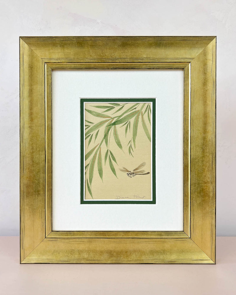 Diane Hill's original chinoiserie painting 'Dragonfly And Foliage (A)' in a gold frame on a plain white background