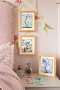 3 framed chinoiserie mini wall art prints in multi colours featuring botanical illustrations of birds, flowers, butterflies, and trees 