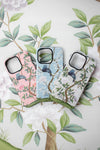 3 luxury chinoiserie phone cases with vintage-style botanical designs featuring birds flowers and trees