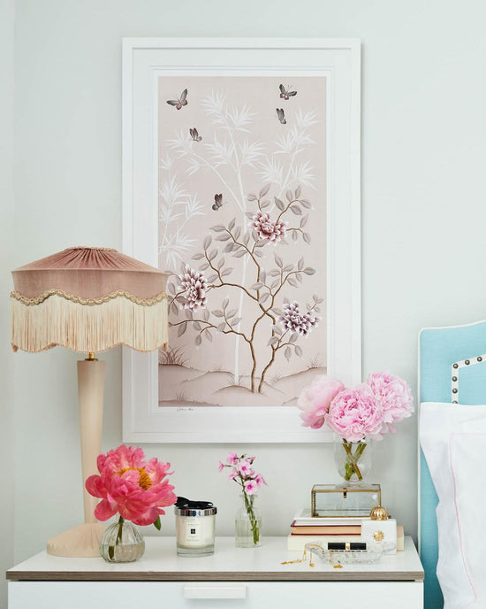 soft pink framed chinoiserie wall art print featuring butterflies, flower branches, and bamboo