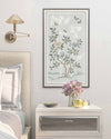 pebble blue framed chinoiserie wall art print featuring butterflies, flower branches, and bamboo hung on wall