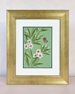 Diane Hill's original chinoiserie painting 'Oleander Emerald' in a gold frame on a plain white background