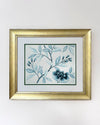 framed classic blue and white chinoiserie art print featuring flowers and branches with gold embellishment 