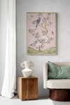 Pink botanical chinoiserie wall art print with flowers and birds in Chinese painting style on wall