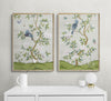 pair of two framed ivory and green botanical chinoiserie wall art prints with flowers and birds in Chinese painting style on wall