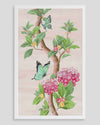 framed Chinoiserie style art print featuring butterflies and pink flowers on a pastel pink background