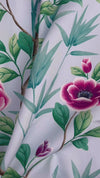 close up of blue chinoiserie fabric featuring bamboo and flowers