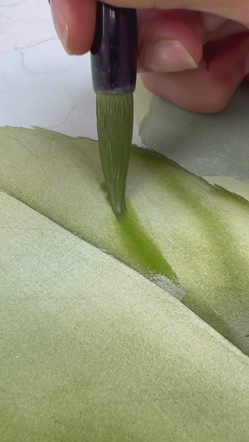 A video of Diane Hill hand painting hydrangea flowers using watercolours and chinese brushes on silk