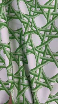 close up of green geometric fabric featuring chinoiserie trellis design