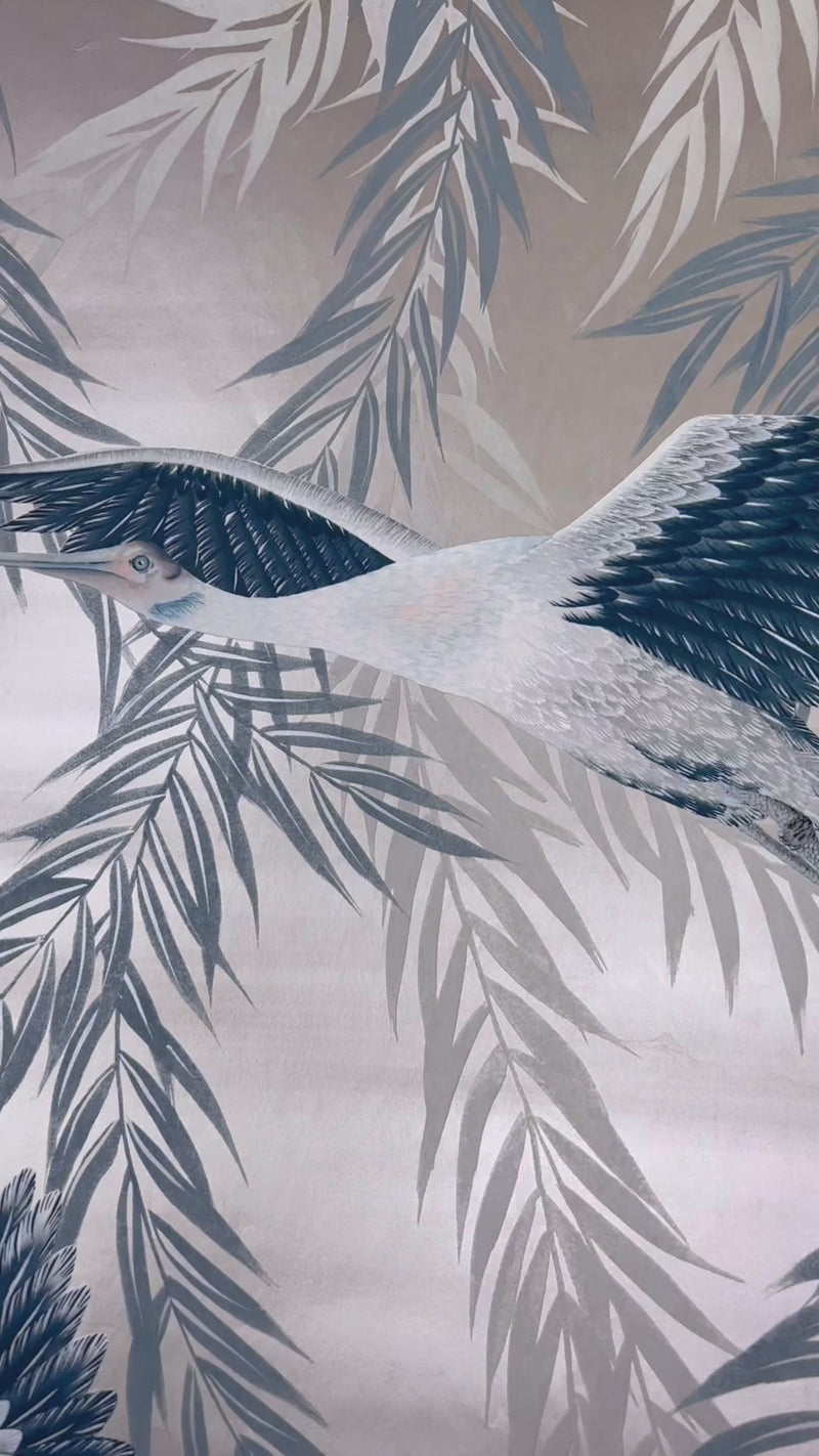 close up of metallic blue tonal botanical wallpaper featuring chinoiserie style birds