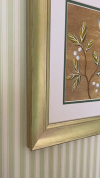 Video of framed gold chinoiserie botanical art print on bedroom wall