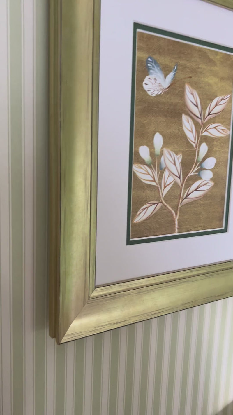 Video of framed gold chinoiserie botanical art print on bedroom wall