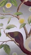 close up of silver and green botanical wallpaper featuring chinoiserie style animals and fruit