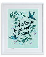 framed blue vintage-style chinoiserie wall art print featuring birds and branches with the quote 'a change is gonna come'