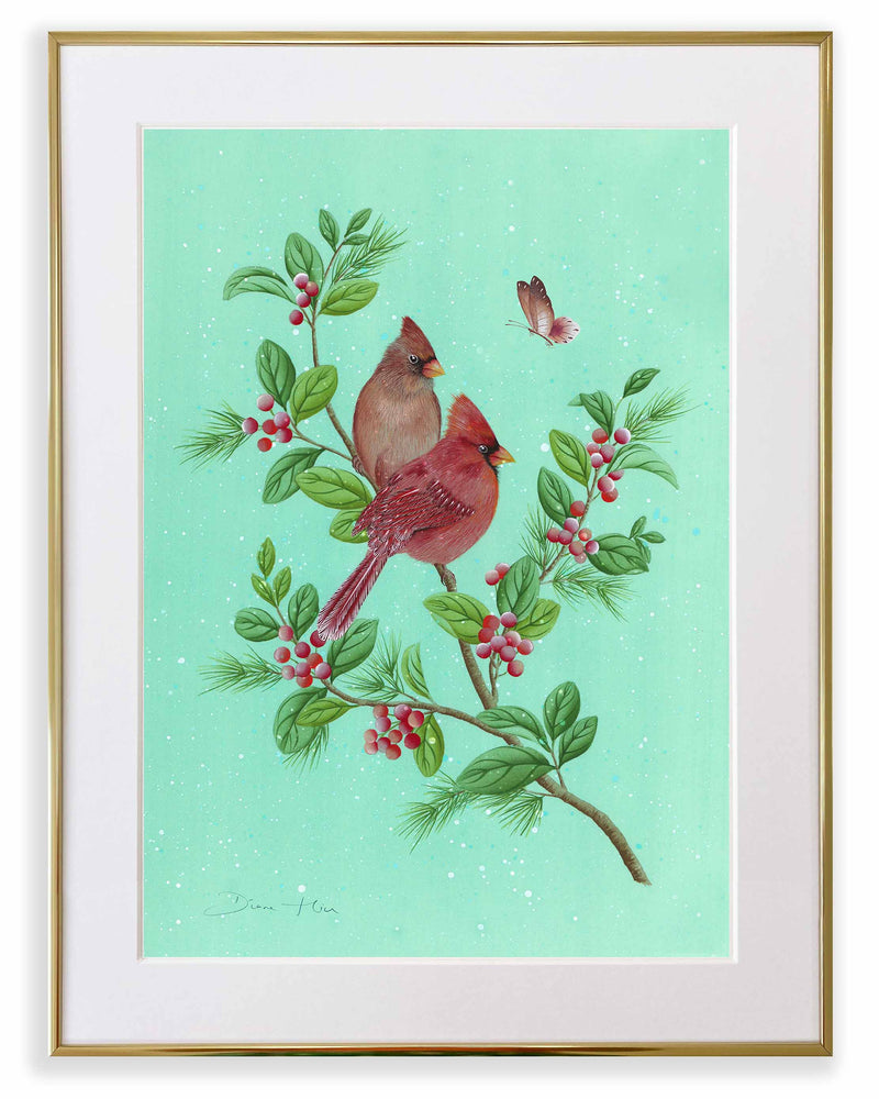 framed winter-themed chinoiserie art print featuring two cardinals and butterfly on a holly branch on green snowy background