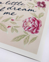 close up of pink vintage-style chinoiserie wall art print featuring flowers and leaves with the quote 'dream a little dream of me'