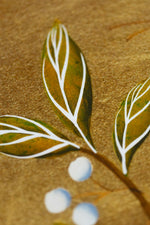 close up of gold chinoiserie leaf painting