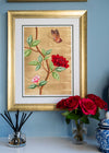 framed chinoiserie wall art print featuring vintage-style butterfly and flower branch on gold leaf background hung on wall