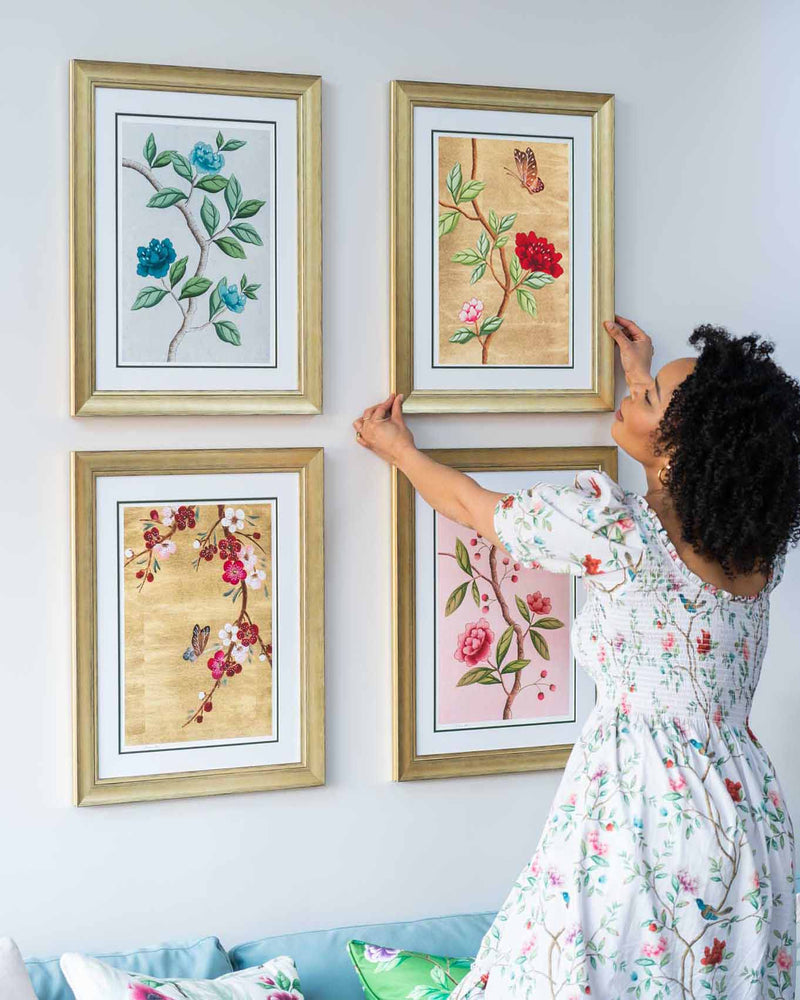 set of 4 colourful framed chinoiserie wall art print featuring vintage-style butterflies, blossoms, and flower branches displayed as gallery wall