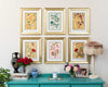 set of 6 colourful framed chinoiserie wall art print featuring vintage-style butterflies, blossoms, and flower branches displayed as gallery wall