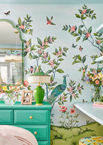 Chinoiserie wallpaper mural blue colourful with exquisitely painted peacock bird and butterflies in a bedroom 
