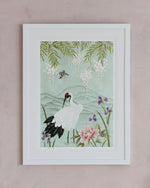 framed chinoiserie wall art print featuring Japanese inspired crane, flowers, and wisteria on a blue mountain background