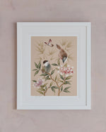 Rosie Art Print, framed in a classic white frame against a pink wall. The Rosie art print by Diane Hill is a beautifully restful, calming chinoiserie style art print featuring soft colours which will look perfectly at home in a bedroom, bathroom or any space that could use a little soothing influence.