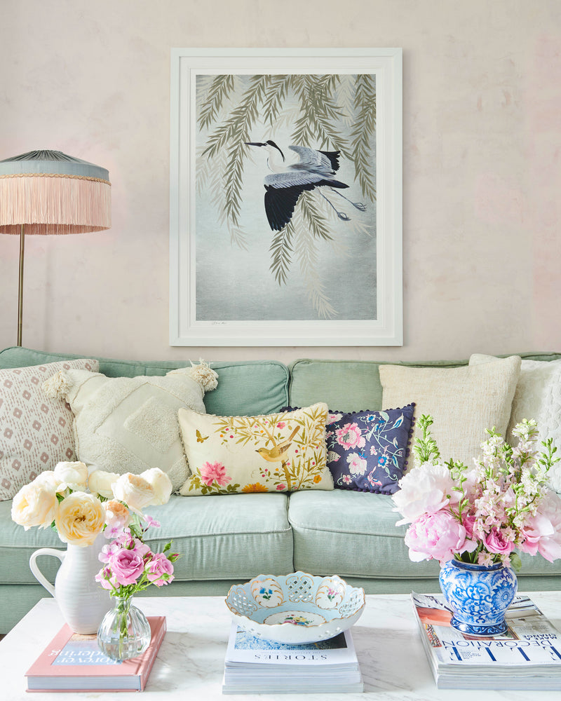 framed Japanese-style chinoiserie wall art print featuring heron and wisteria on silver background hung on wall