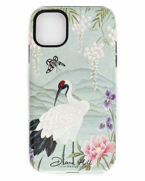 The Elina phone case by Diane Hill, against a white background. Elina features a graceful white bird standing in front of a pale blue mountainscape, with butterflies and blossom overhead, and peonies and iris in the foreground.