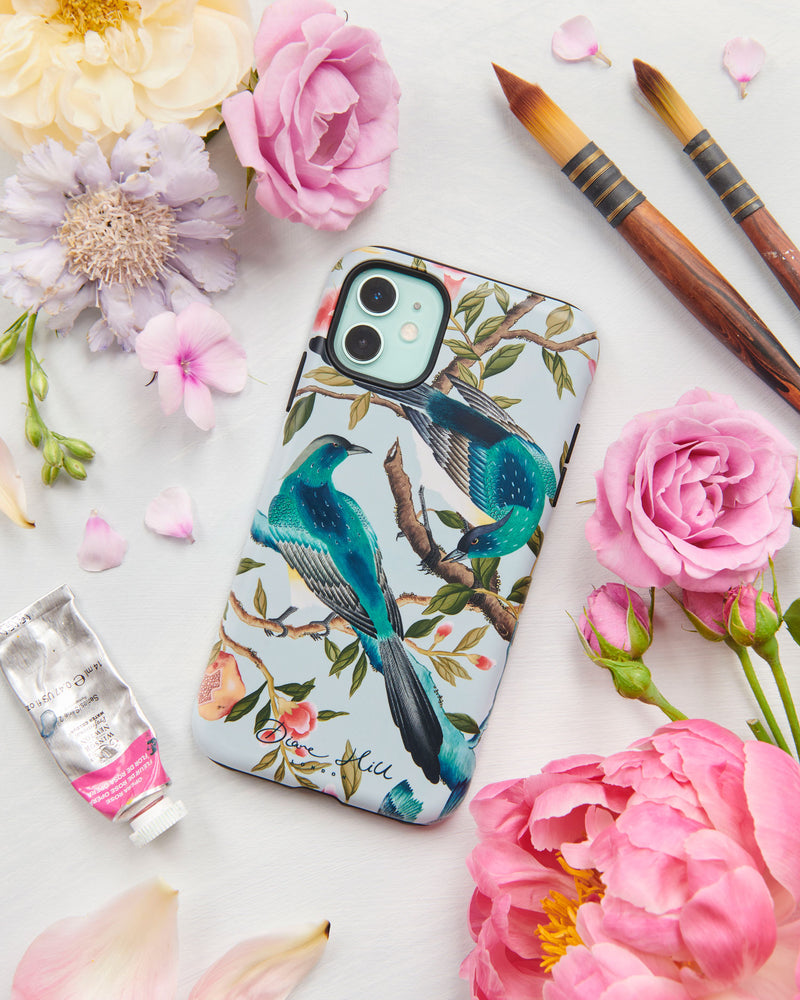 The Felicity phone case by Diane Hill. A riot of bright, beautiful colour, rich botanicals and exquisitely-feathered birds, Felicity is a celebration of the beauty of nature. A styled flatlay set with peonies and paintbrushes