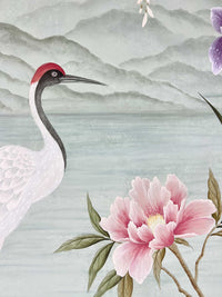 close up of Japanese style chinoiserie painting featuring crane, flowers, and hanging wisteria on blue mountain background