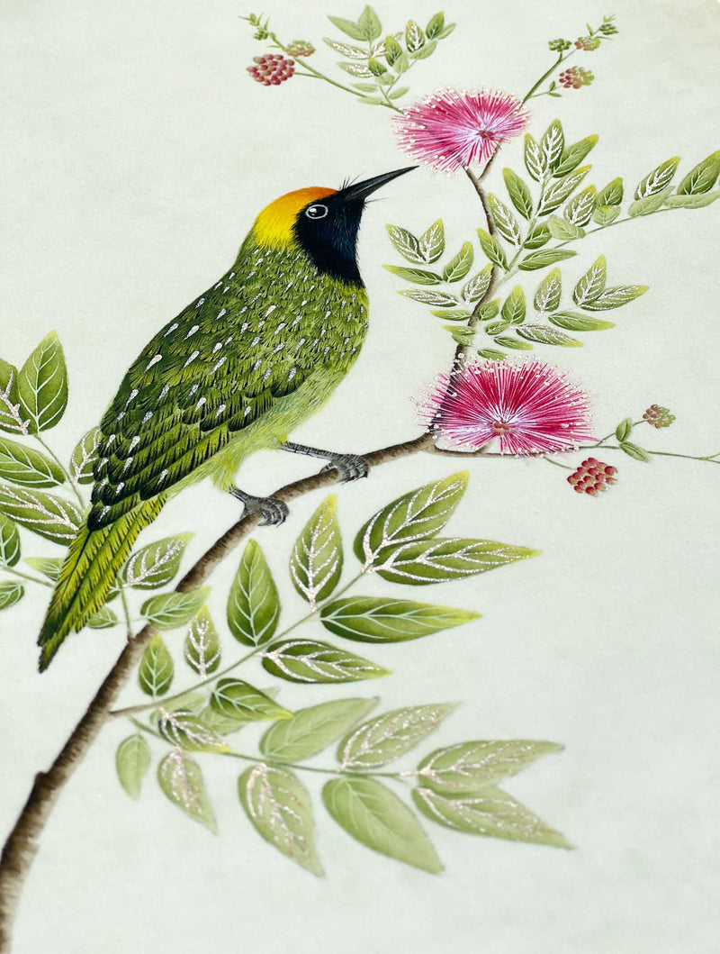 close up of botanical wall art print featuring gold sparkle embellished exotic bird on tree branch with flowers