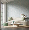 blue botanical wallpaper featuring chinoiserie style bamboo in modern living room