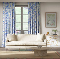 classic blue and white chinoiserie fabric featuring bamboo and flowers on curtains in modern living room