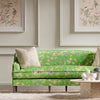 green chinoiserie fabric featuring bamboo and flowers on sofa in modern living room