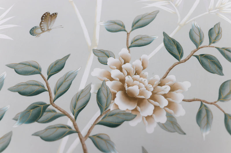 A close up of the stunning detail of the hand painted peonies and butterflies that feature within the Lilly art print by Diane Hill, with soft green, blue and bronze tones.