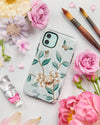 Luxury phone case featuring vintage style butterflies and flower branches with a bamboo background