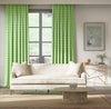 green geometric fabric featuring chinoiserie trellis design on curtains in modern living room