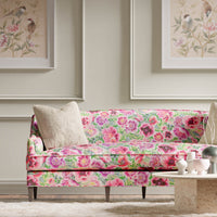 green and pink floral chinoiserie fabric on sofa in modern living room