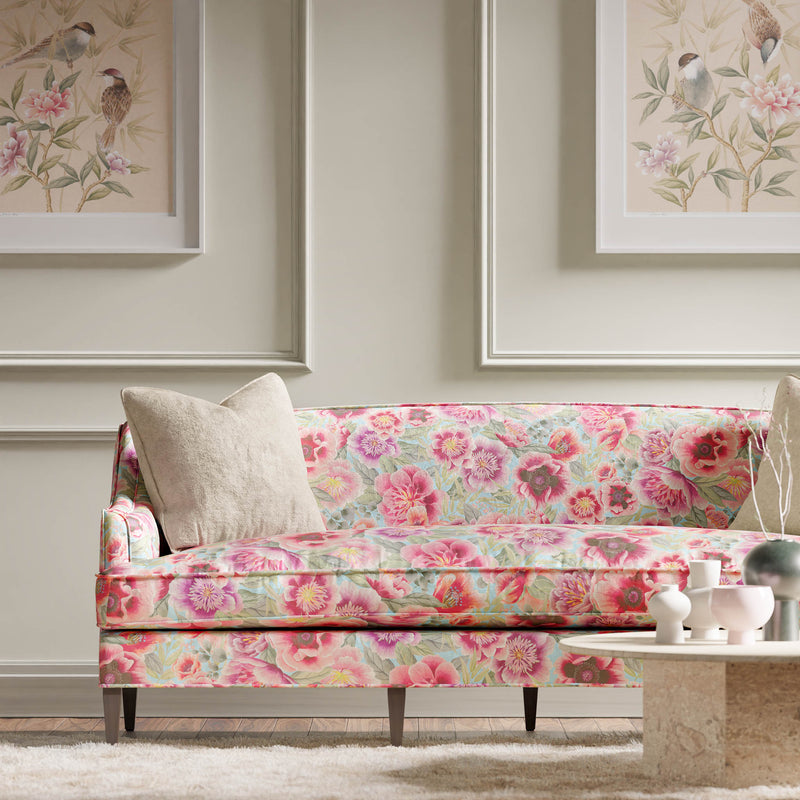 blue and pink floral chinoiserie fabric on sofa in modern living room