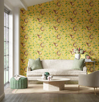 yellow botanical wallpaper featuring chinoiserie style animals and fruit in modern living room