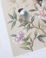 Close up of the printed signature which appears at the foot of the Rosie chinoiserie art print by Diane Hill, featuring two little songbirds perched upon twigs, with pink and lilac peonies