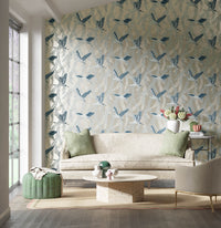 blue tonal botanical wallpaper featuring chinoiserie style birds in modern living room