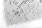 close up of silver chinoiserie art print featuring bird on branch with flowers
